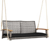 2-person patio wicker hanging swing chair with gray PE rattan, black cushion, and acacia wood armrests for outdoor.