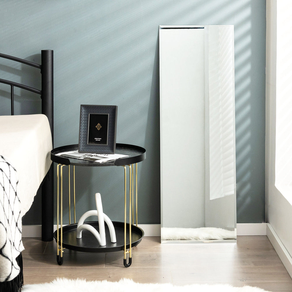 Frameless full-length mirror mounted on the wall, ideal for bedrooms and living rooms, featuring a sleek design and.