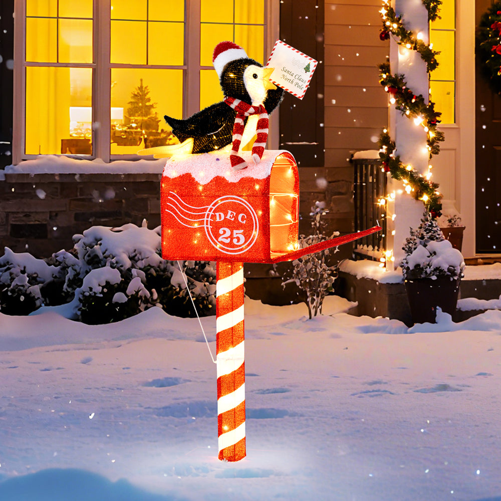 4.8 FT Christmas decoration featuring a cheerful penguin atop a mailbox, illuminated with 100 warm white LEDs for.