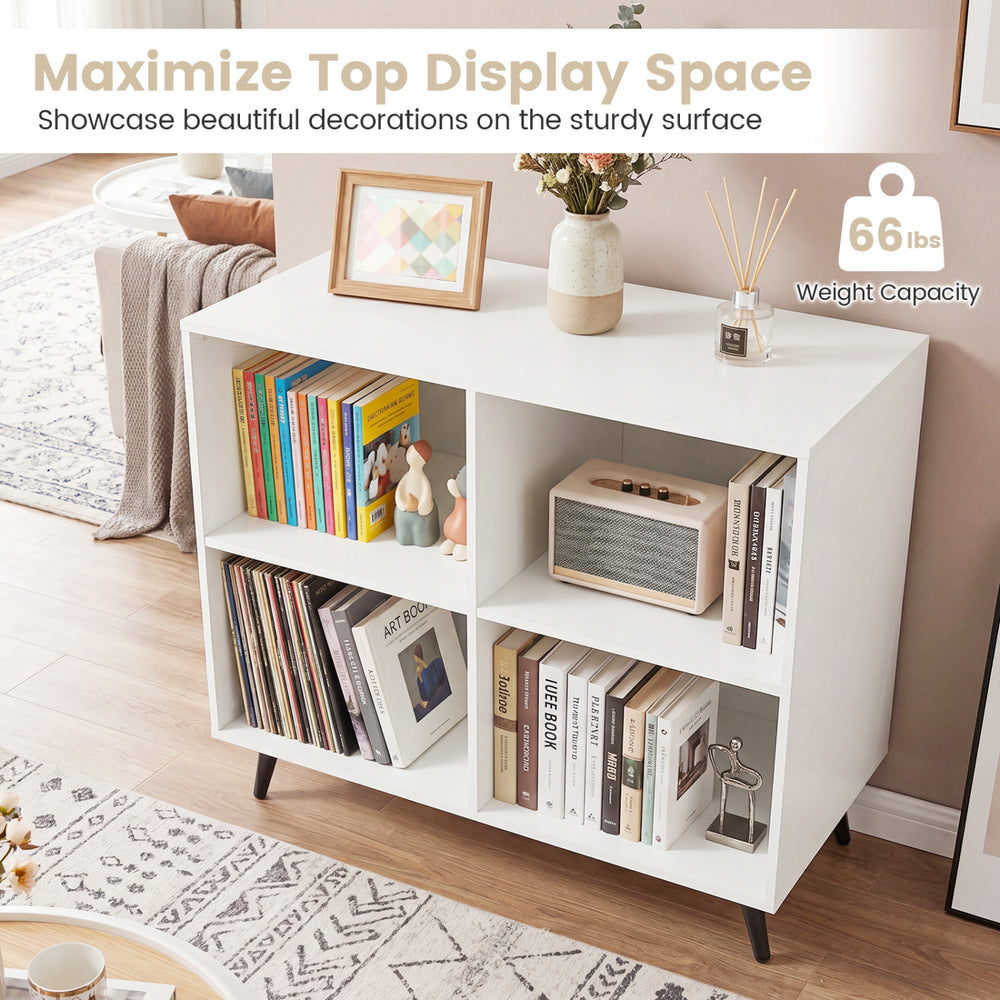 White 4-cube wooden bookshelf with 5 metal legs, perfect for displaying decorations and organizing items in any room.