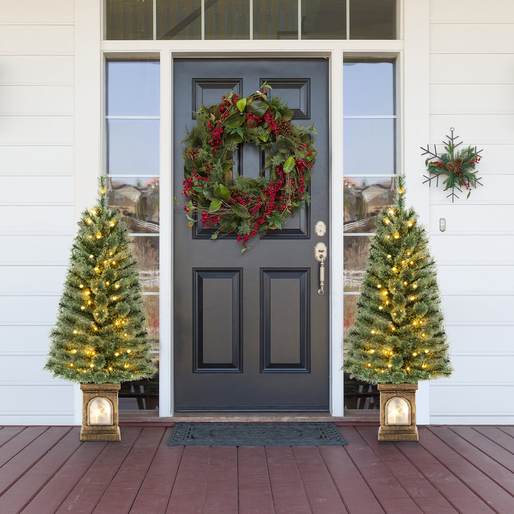Pre-lit 4 feet potted Christmas tree with warm LED lights and antique urn base, perfect for festive outdoor decor.