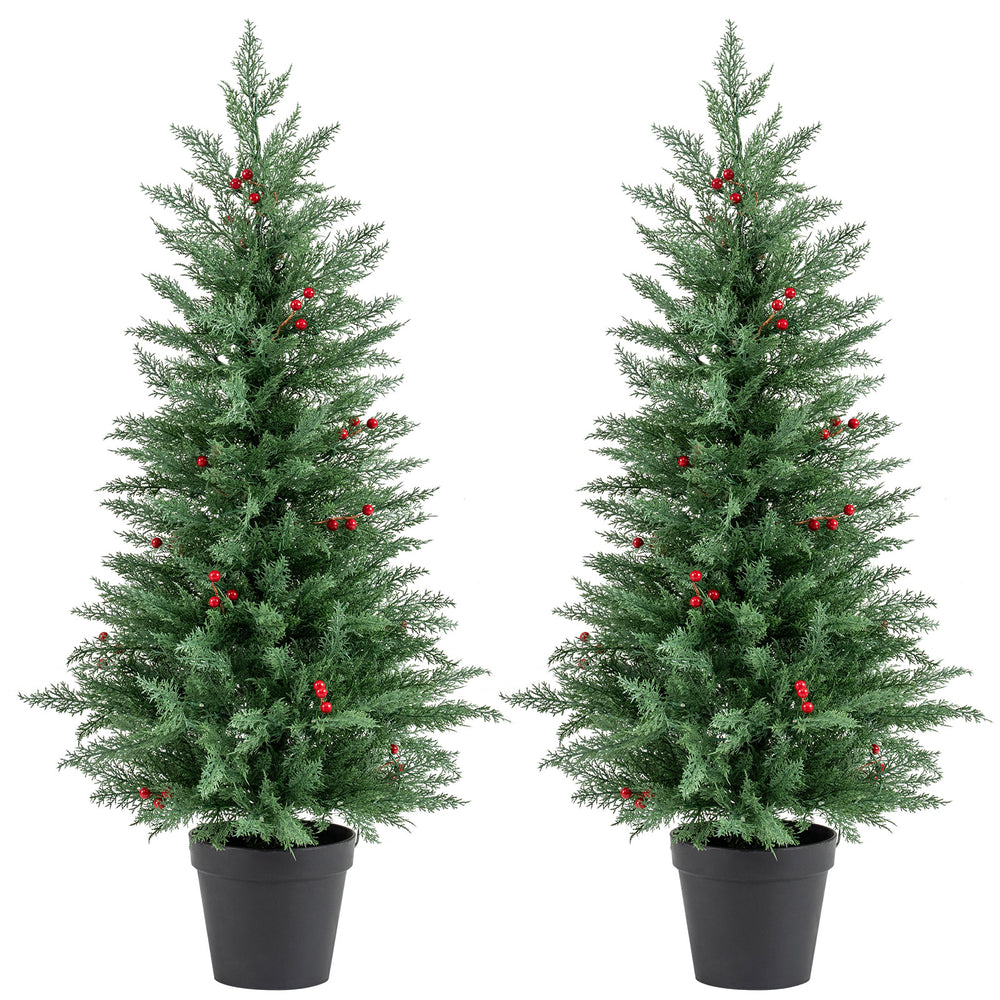 Two 4 FT pre-lit Christmas trees with 70 warm white LED lights and red berries, perfect for festive decor.