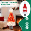 Close-up of the vibrant 4 ft artificial Christmas tree with Santa hat design, showcasing 300 realistic branch tips and.