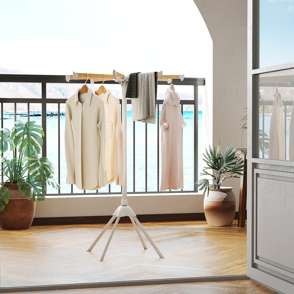Foldable clothes drying rack with 8 bamboo rods, showcasing hanging garments on a balcony for convenient drying.