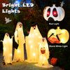 Four spooky white cloth ghosts with red and warm white LED lights, perfect for Halloween yard decorations.