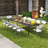 Folding stackable chairs with metal frame in white, set up for outdoor dining, featuring ergonomic backrest and.