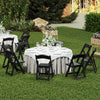 Black resin folding chairs with padded seats arranged around a table, perfect for weddings and outdoor events.