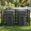 The black wooden outdoor privacy fence encloses trash cans, providing ventilation and a decorative touch to your yard.