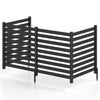 Four-panel black wooden outdoor privacy fence with slatted design and ground stakes for versatile placement and coverage.