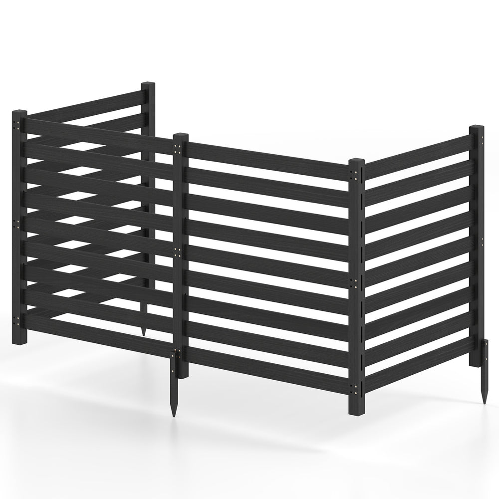 Four-panel black wooden outdoor privacy fence with slatted design and ground stakes for versatile placement and coverage.