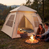 4 Person camping tent with automatic setup, rainfly, and dual doors, set up near a campfire for outdoor leisure.