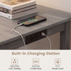 Counter height dining table set in gray with built-in charging station, sturdy rubber wood, and ergonomic saddle seats.