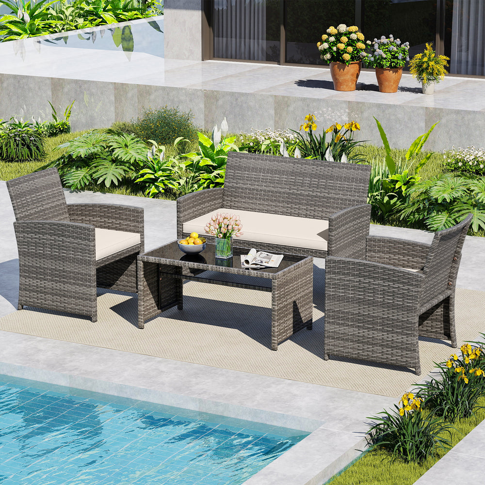 4-piece patio conversation set featuring handwoven gray PE rattan, soft cushions, and a tempered glass tabletop by the.