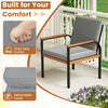 Gray patio chair with solid wood armrests, thick removable cushions, and a sturdy metal frame for outdoor comfort.