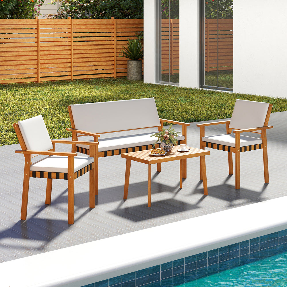 4-piece patio furniture set featuring acacia wood, soft cushions, and a coffee table, ideal for backyard relaxation.
