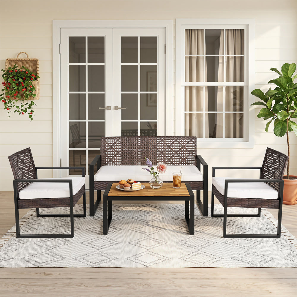 4-piece patio set featuring wicker chairs and an acacia coffee table, perfect for backyard relaxation.