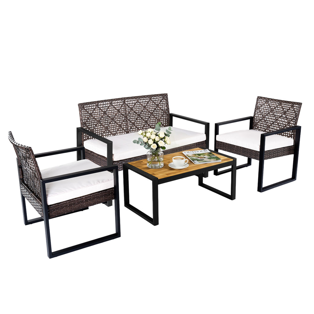 4-piece patio set featuring brown wicker chairs and an acacia coffee table, perfect for backyard relaxation.