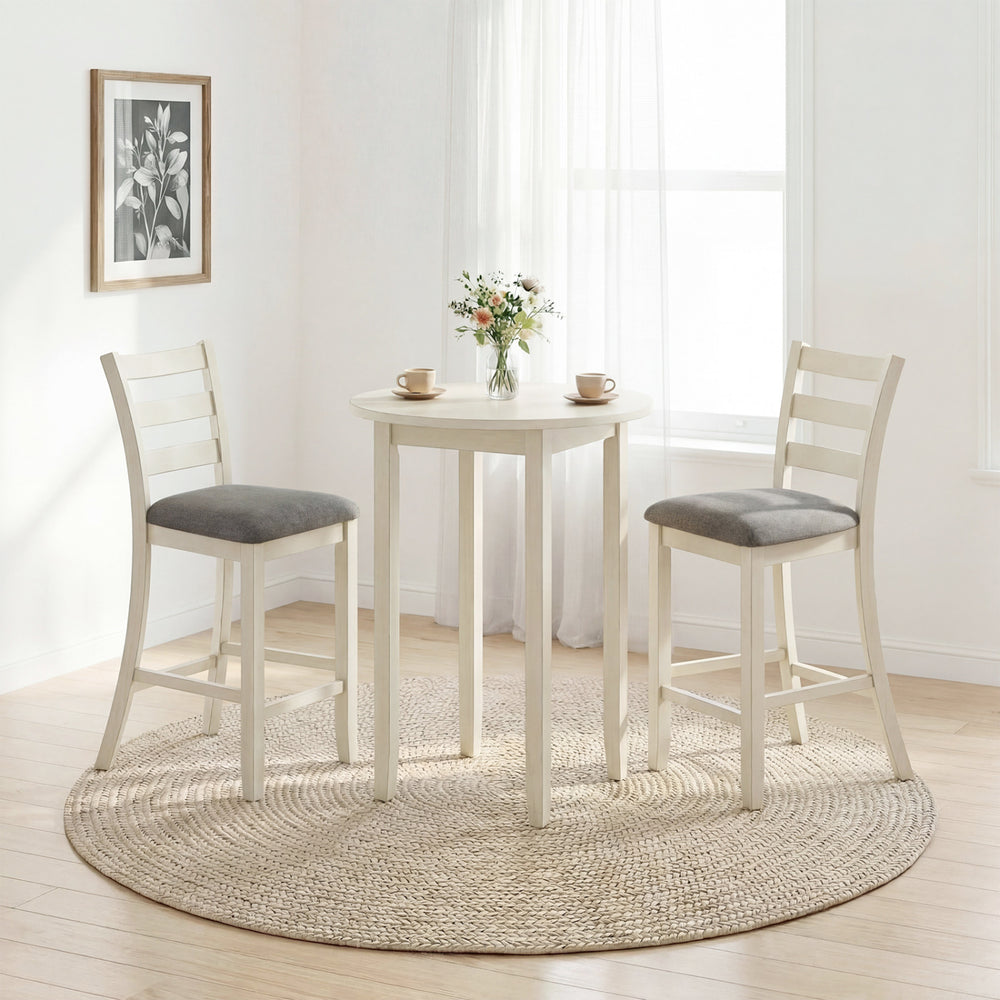 Counter height table set featuring two beige chairs with fabric seats and rubber wood legs, perfect for dining areas.