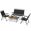 Folding patio furniture set with black chairs and SPC coffee table, perfect for garden or backyard relaxation.
