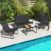 Outdoor conversation set featuring a black loveseat, two armchairs, and a tempered glass coffee table by the pool.