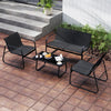 4-piece patio furniture set featuring a loveseat, two chairs, and a glass coffee table for outdoor relaxation.