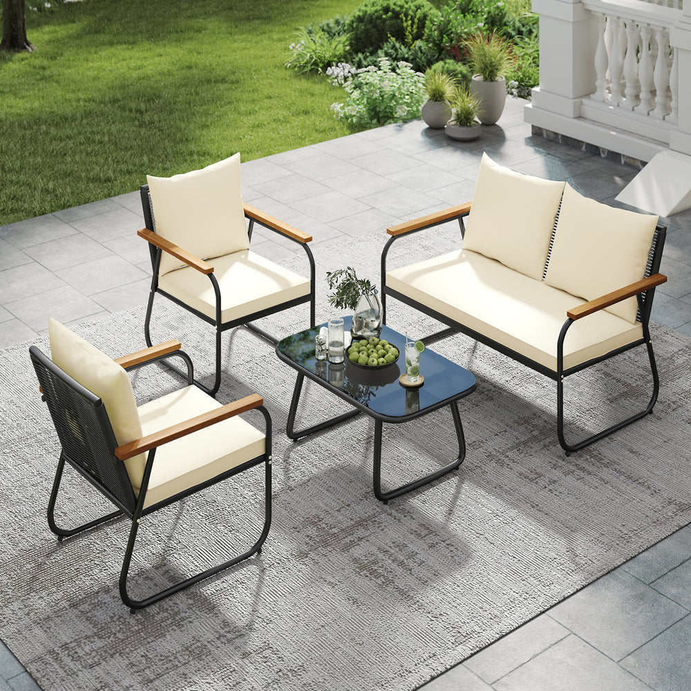 4-piece patio furniture set featuring a tempered glass coffee table, cushioned loveseat, and chairs for outdoor.