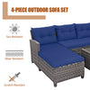4-piece patio rattan sofa set with navy cushions, featuring a coffee table, ideal for outdoor relaxation and gatherings.