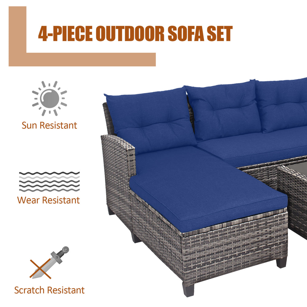 4-piece patio rattan sofa set with navy cushions, featuring a coffee table, ideal for outdoor relaxation and gatherings.