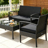 Patio rattan furniture set featuring a loveseat, two single sofas, and a coffee table with black cushions for outdoor relaxation.