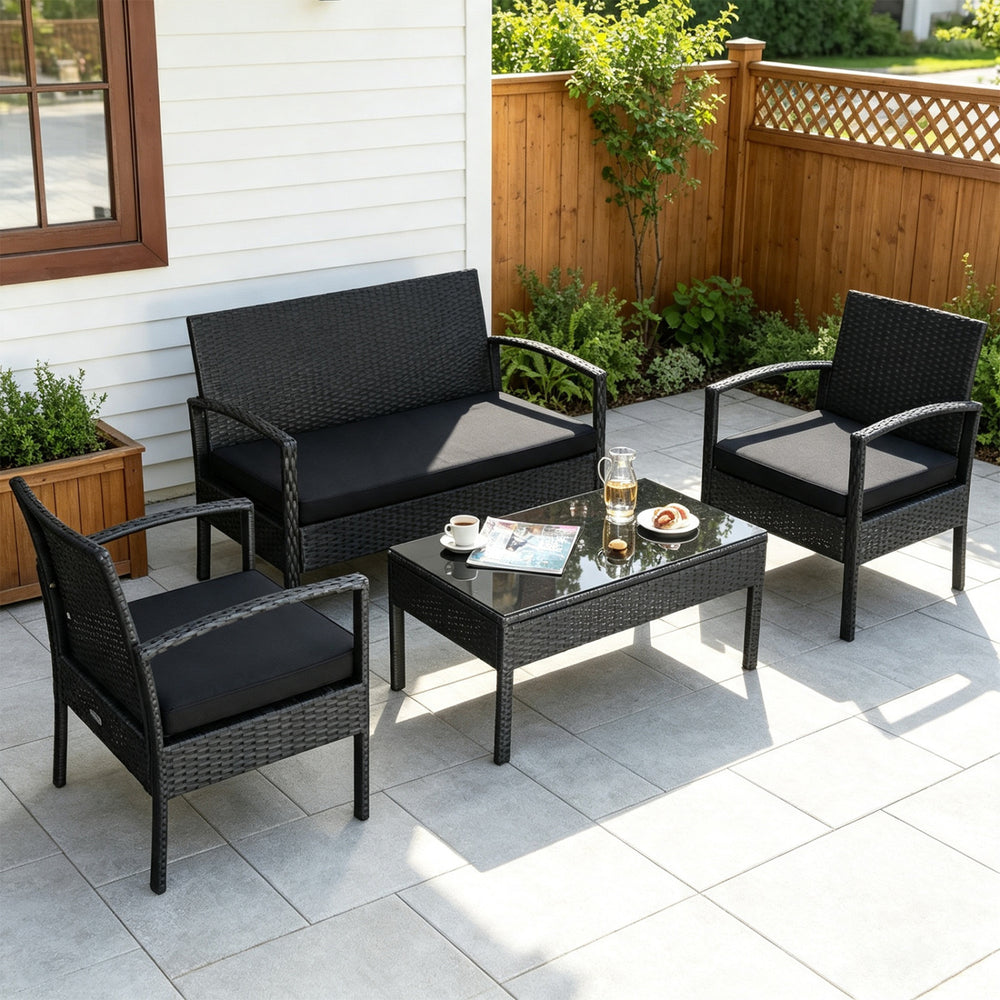 Patio rattan furniture set featuring a loveseat, two single sofas, and a coffee table, perfect for outdoor relaxation.