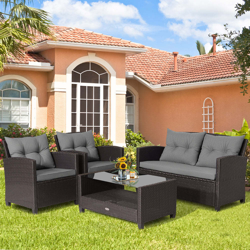 4-piece patio rattan furniture set featuring gray cushions, including a coffee table, loveseat, and two single sofas.