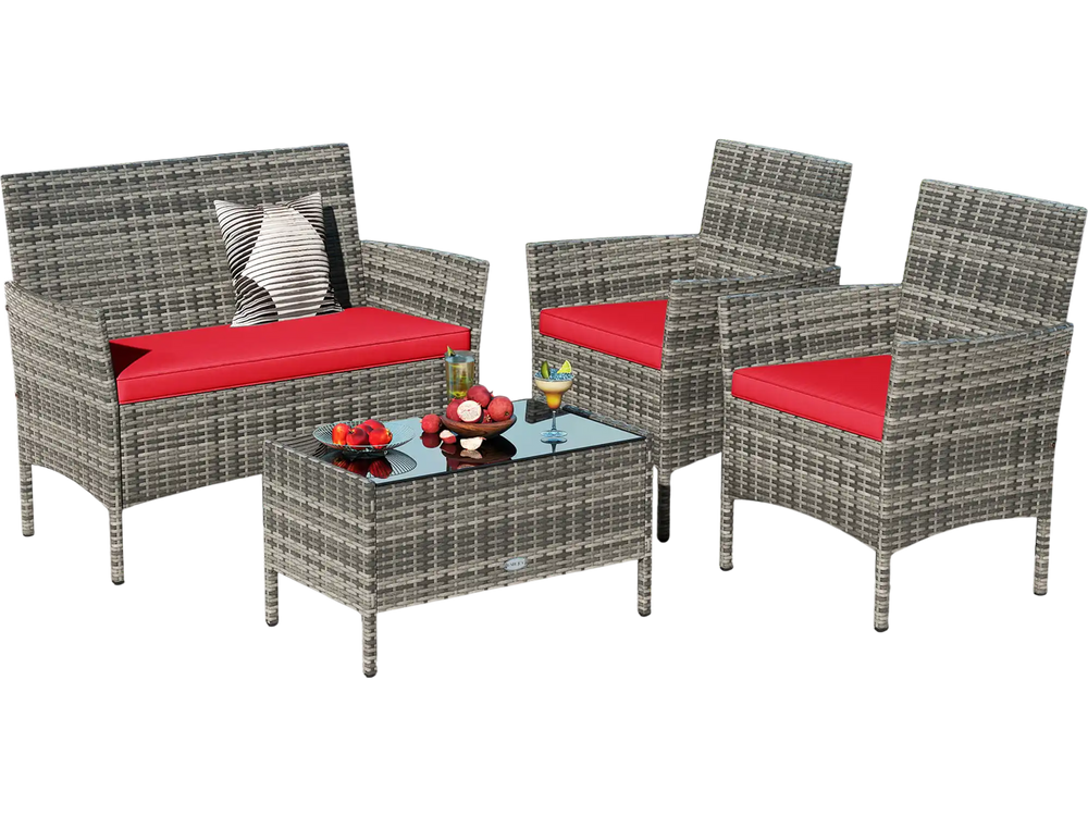 4-piece patio rattan conversation set with red cushions and tempered glass coffee table, ideal for outdoor relaxation.