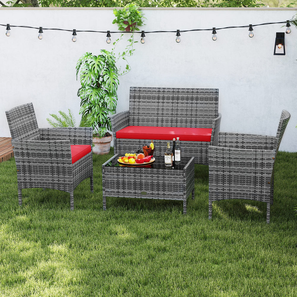 4-piece patio rattan conversation set with red cushions and tempered glass coffee table, perfect for backyard.