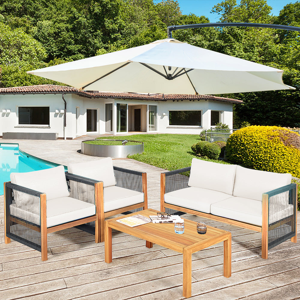 4-piece wood outdoor patio furniture set with soft cushions, ideal for garden or poolside relaxation.