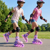 Two kids skating in purple adjustable inline skates with glowing wheels, perfect for ages 9-14, promoting balance and.