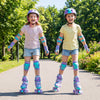Two girls wearing adjustable purple roller skates with light-up wheels, enjoying a sunny day in the park.