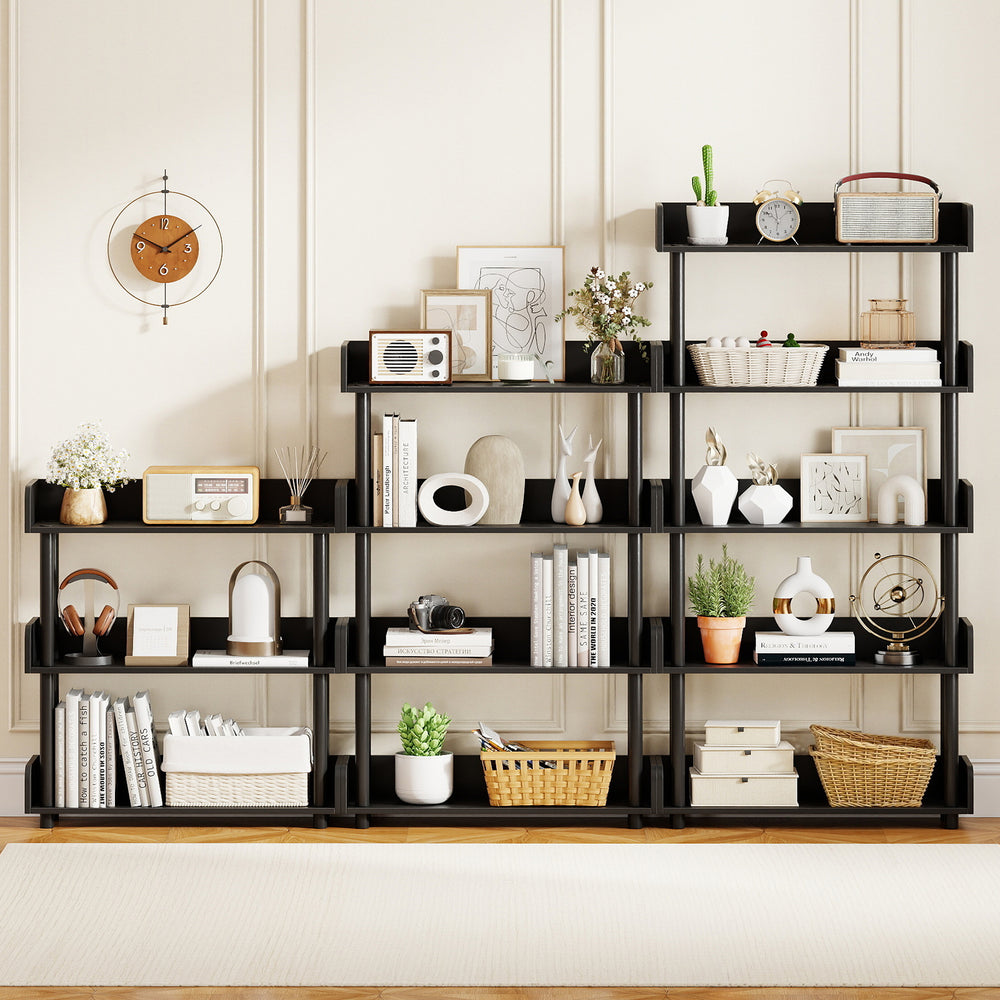 4-tier black bookshelf with anti-tipping kit, ideal for living rooms and offices, showcasing books and decor.