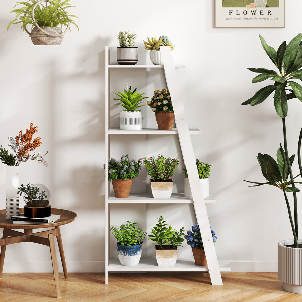 4-tier white wooden bookshelf displaying various houseplants, perfect for small spaces and enhancing home decor.
