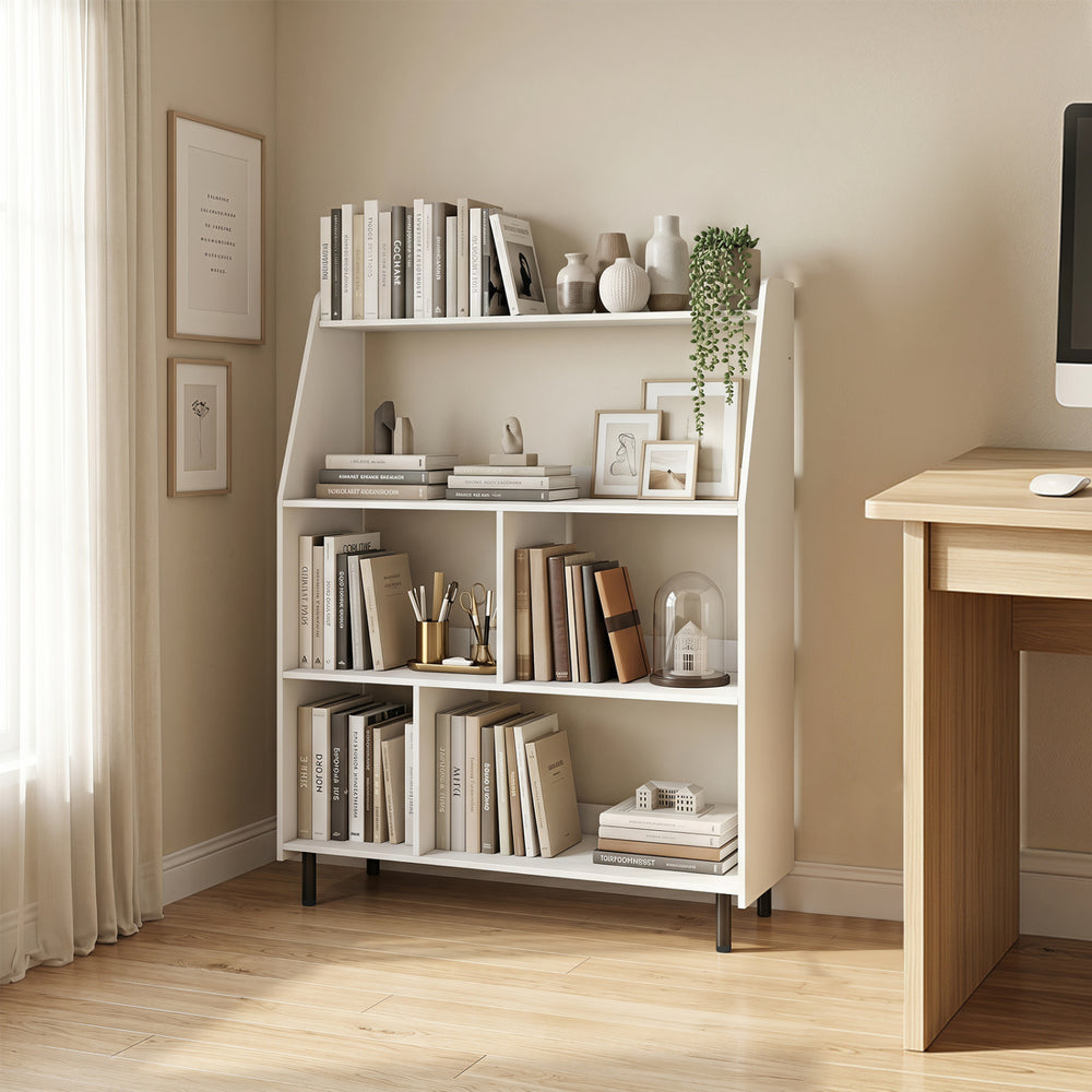 4-tier open modern bookcase in white showcased in a cozy room, perfect for displaying books and decorative items.