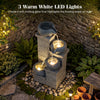 4-tier outdoor water fountain with cascading bowls and LED lights, creating a serene atmosphere for relaxation at night.