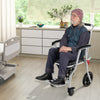4-in-1 foldable bedside commode chair with brakes, footrest, and PU leather seat, ideal for elderly mobility in a home.