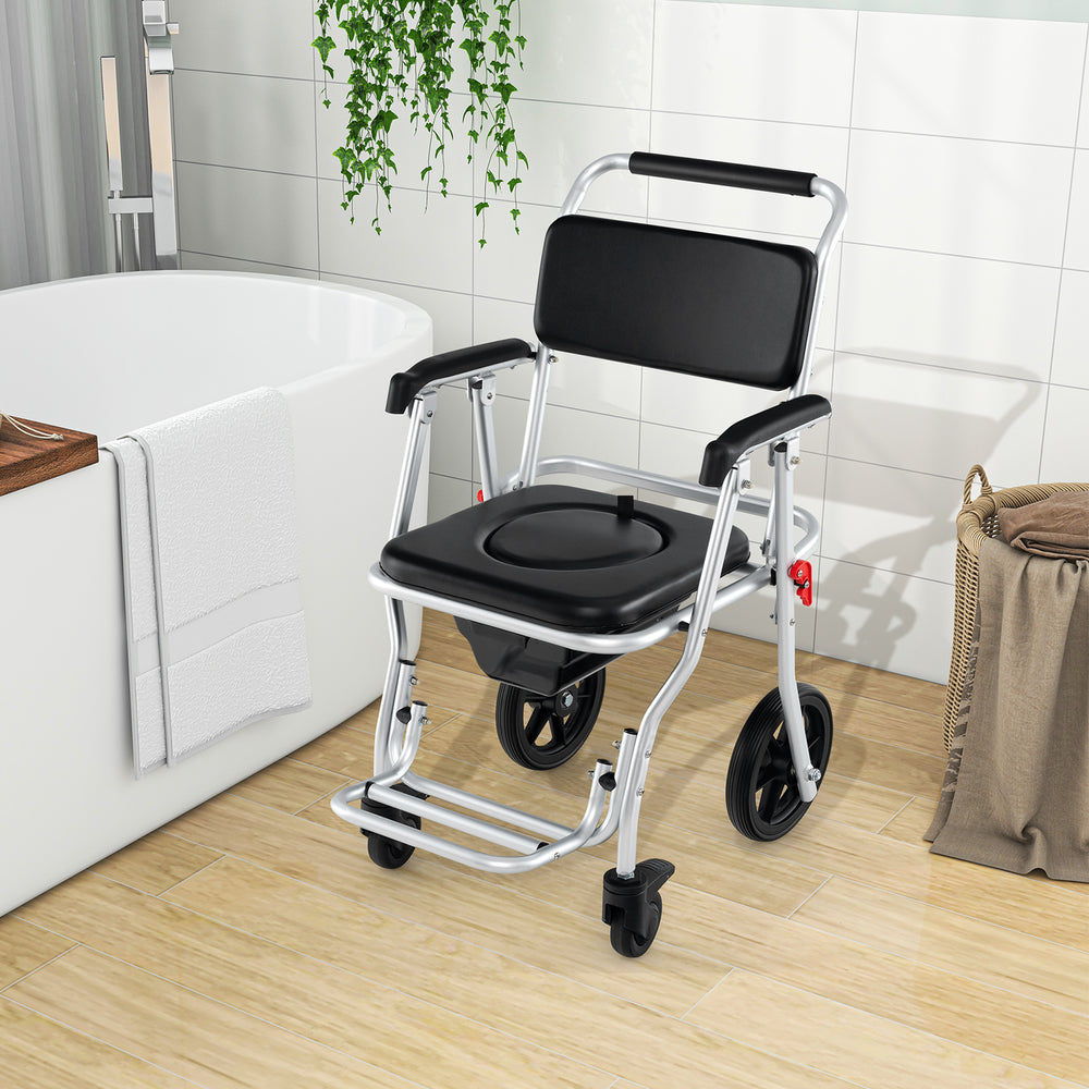 Foldable bedside commode chair with brakes, bucket, and footrest, designed for stability and easy mobility in bathrooms.