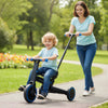 Toddler riding the navy 4-in-1 foldable tricycle with push handle, designed for safety and comfort in a park setting.