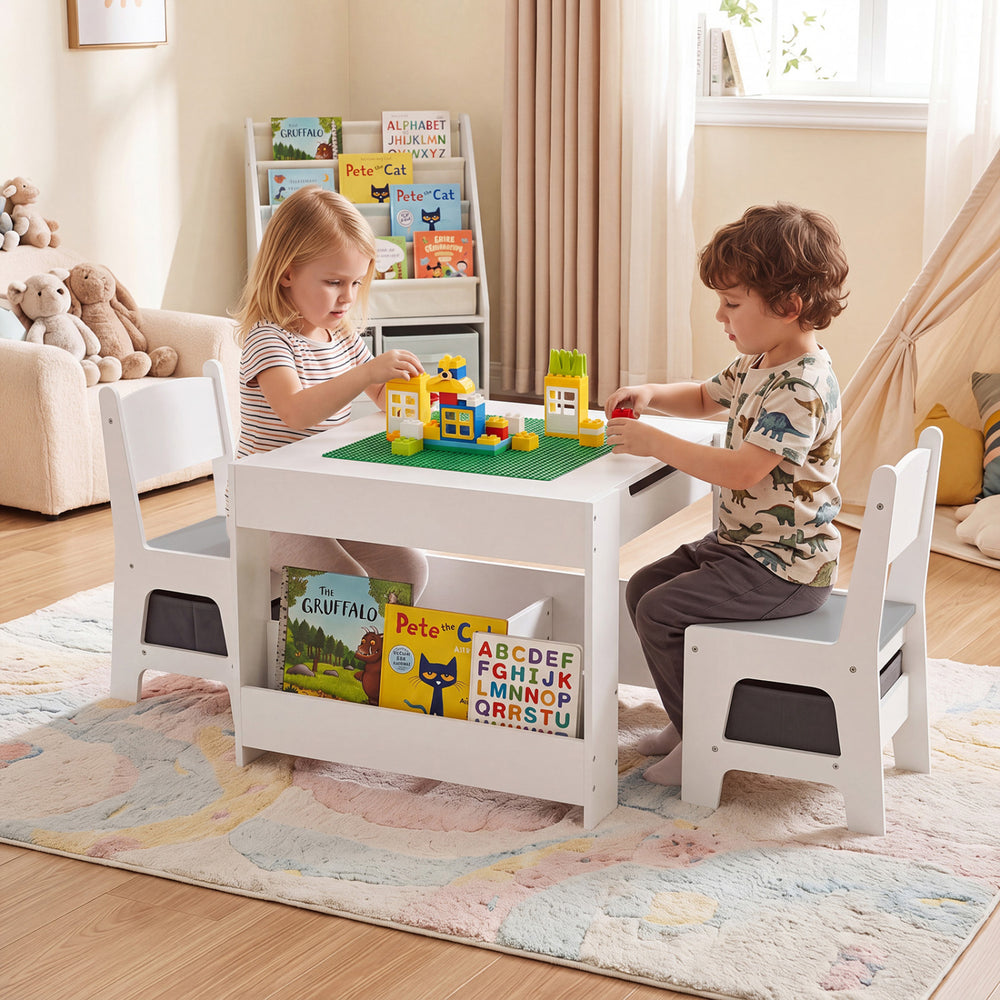 Kids play at a 4 in 1 grey table with building blocks, featuring storage, bookshelves, and comfortable chairs.