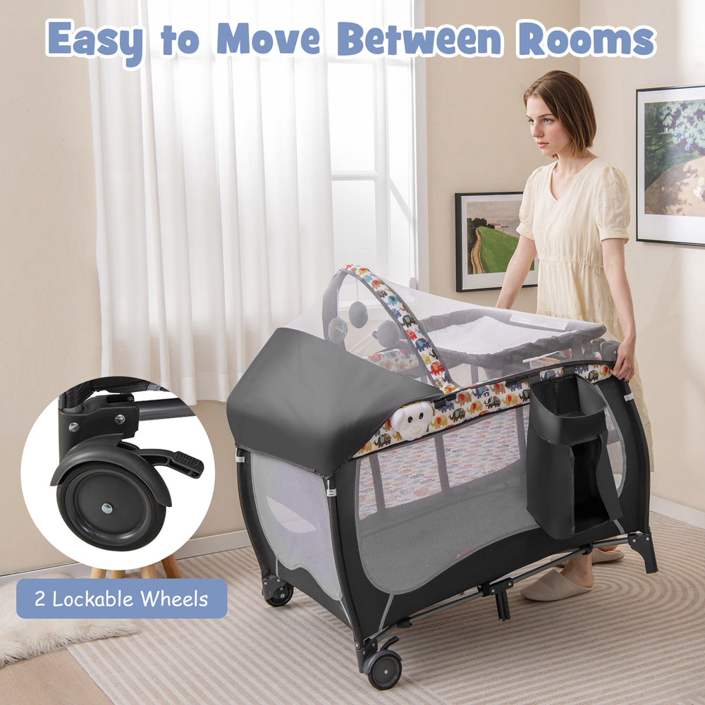 Portable baby nursery center in multicolor with removable changing table and lockable wheels for easy mobility.