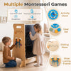 Child uses the adjustable toddler tower with Montessori games, chalkboard slide, and safety board in a kitchen setting.