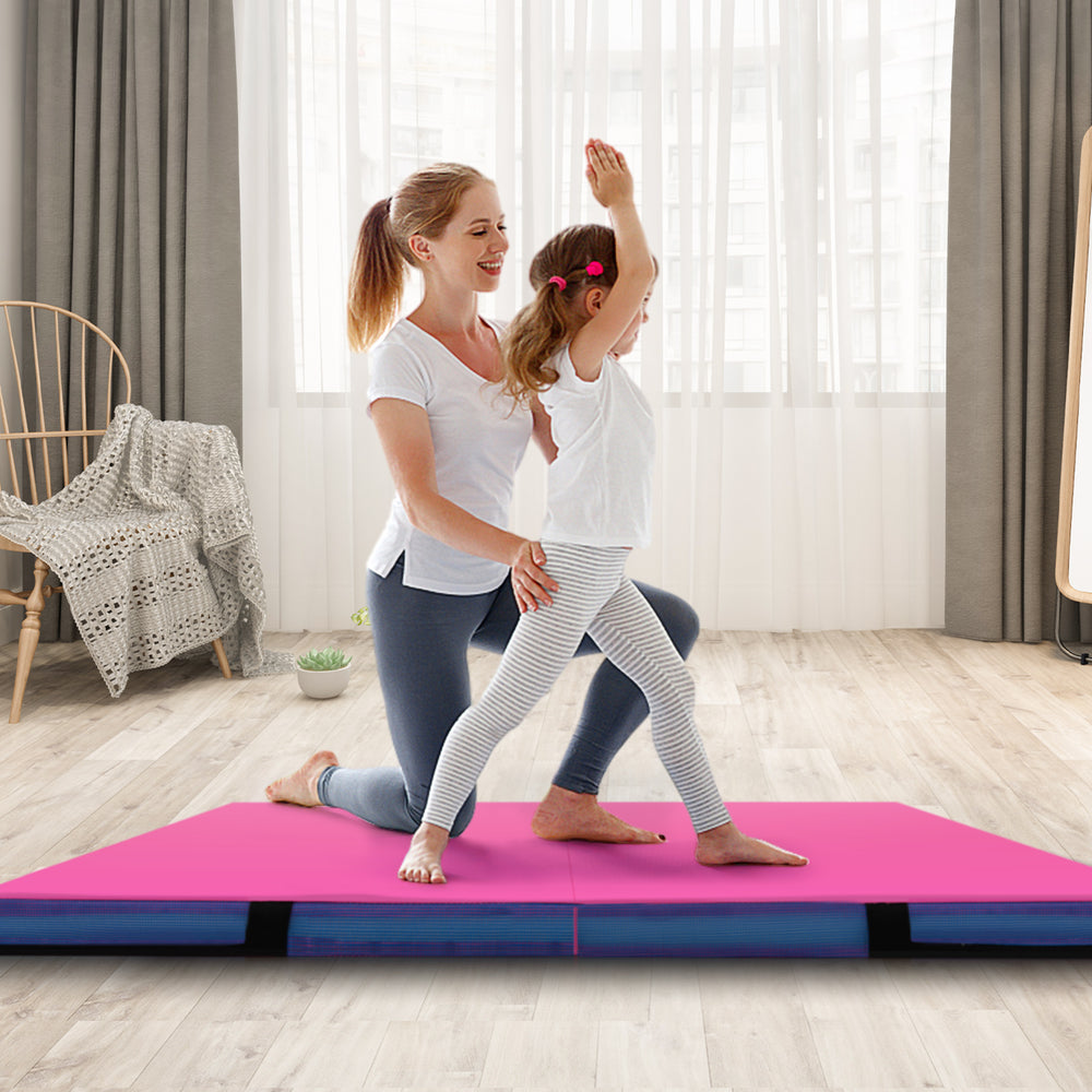 Bi-folding 4ft x 4ft x 4in pink gymnastic tumbling mat with handles, ideal for yoga and kids' activities.