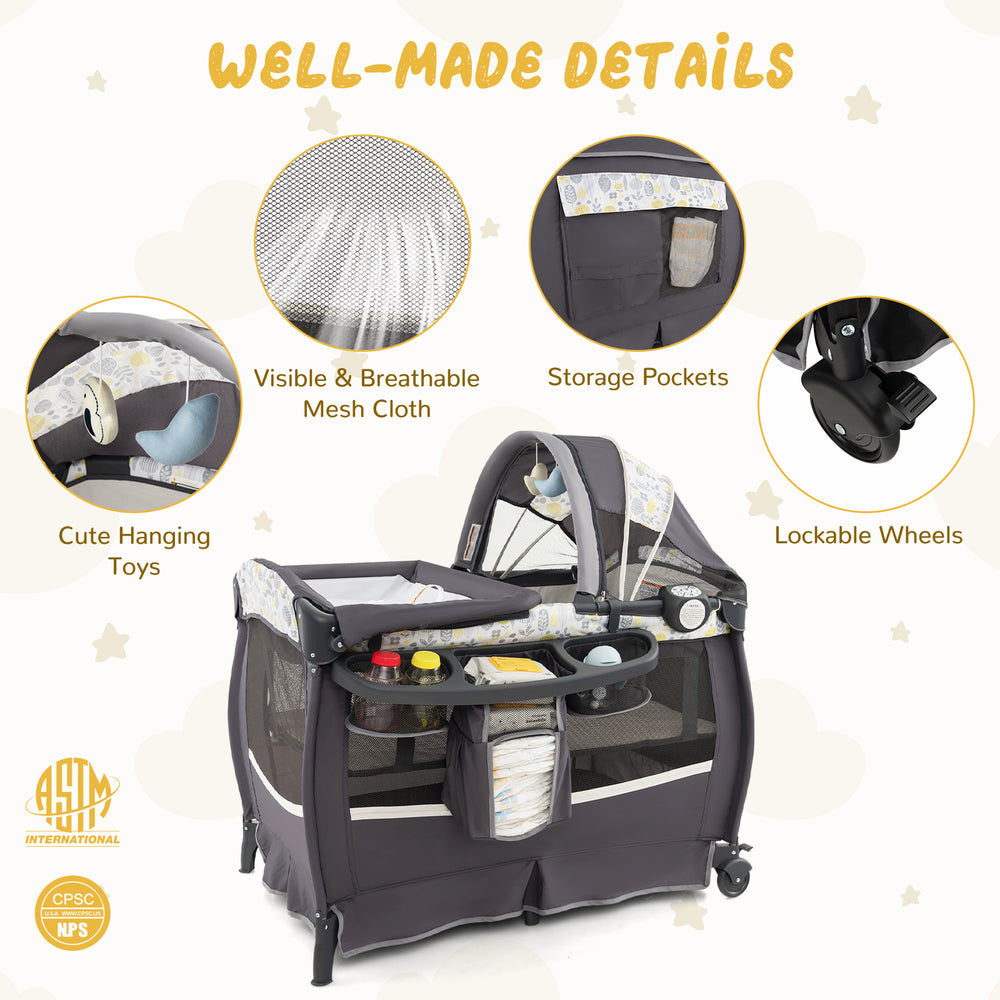 4 in 1 Portable Pack and Play Baby Nursery Center with bassinet, storage pockets, and lockable wheels for convenience.
