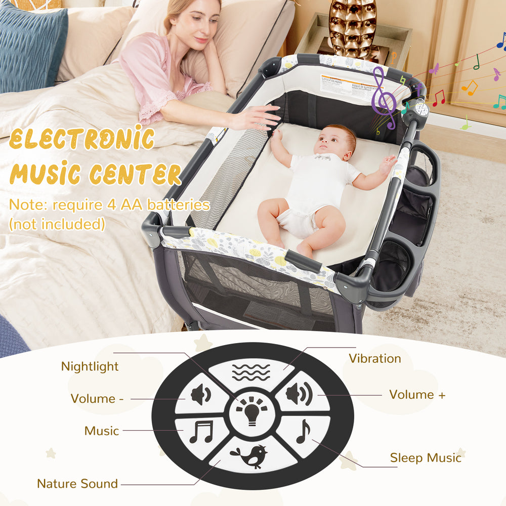 Portable Pack and Play baby nursery center in yellow with bassinet, storage pockets, and electronic music center.