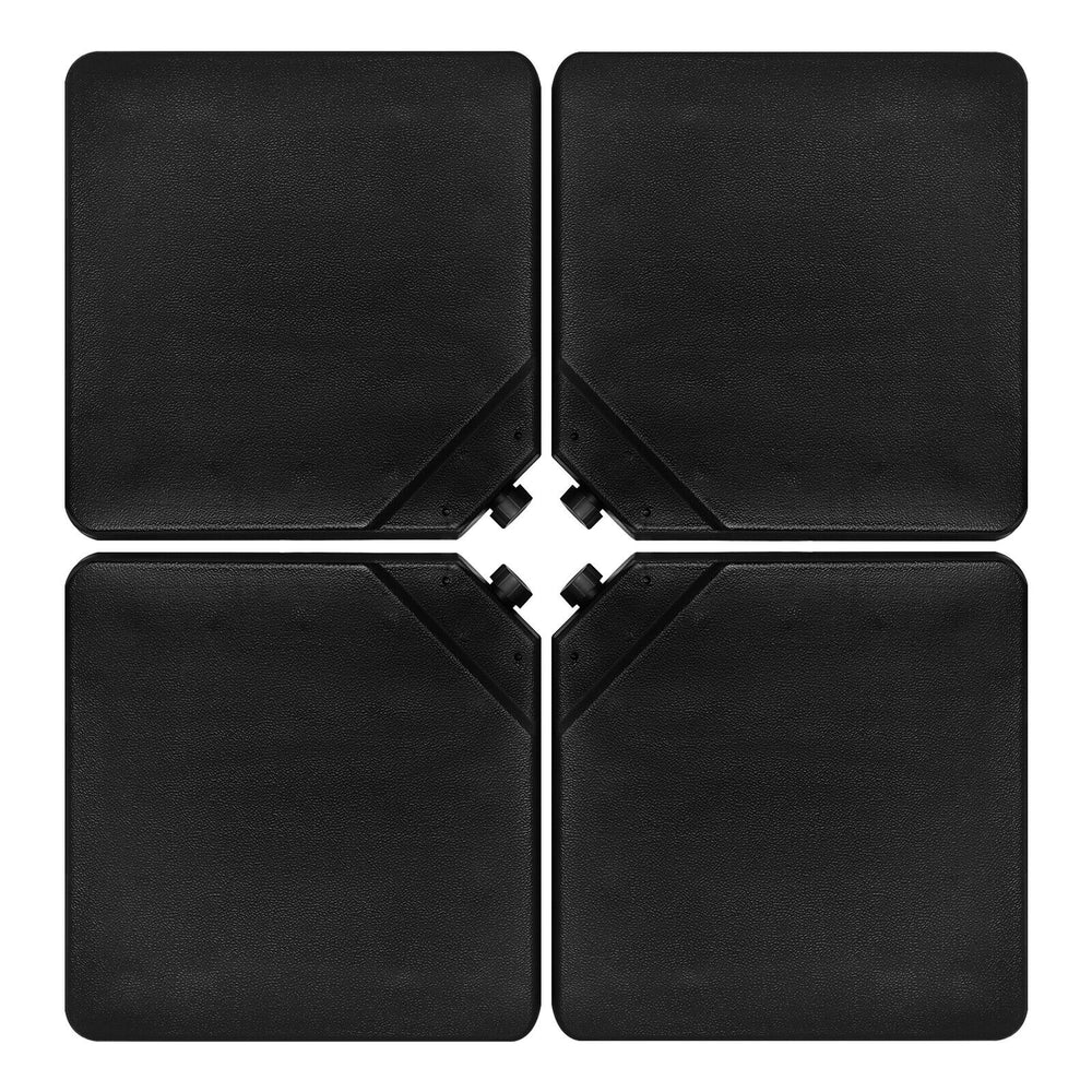 Four black patio umbrella base plates made of durable HDPE, designed for easy filling and stacking for convenient.